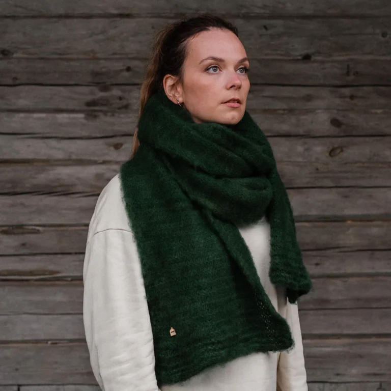 Woman wearing green knit scarf